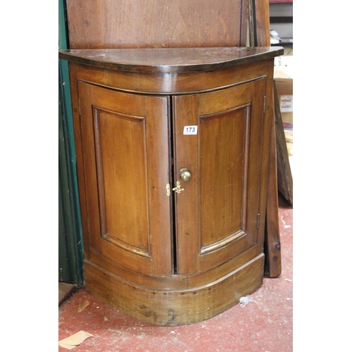 173 - An antique style bow front cabinet.