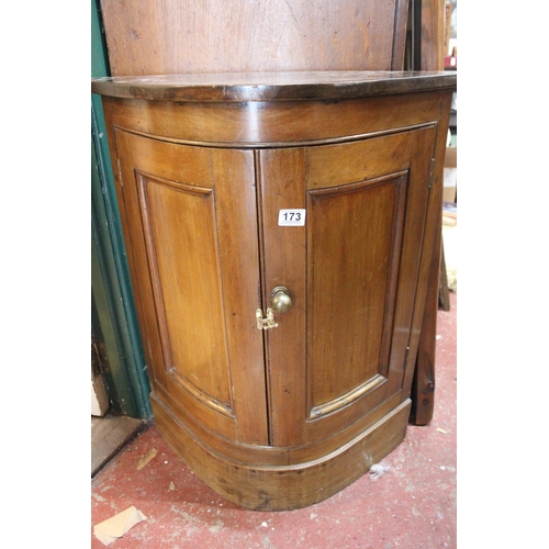 173 - An antique style bow front cabinet.