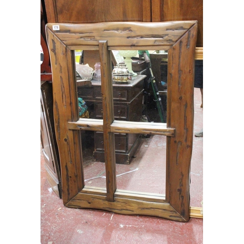 178 - A large chunky pine wall mirror, measuring 32