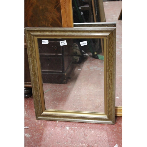 179 - A wooden framed wall mirror, measuring 20.5