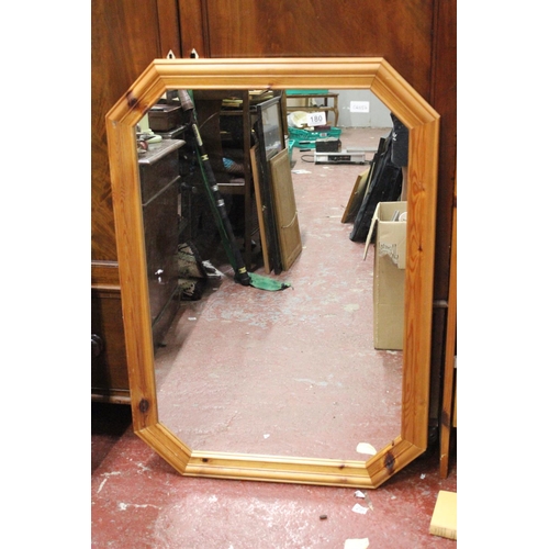 180 - A pine framed wall mirror.