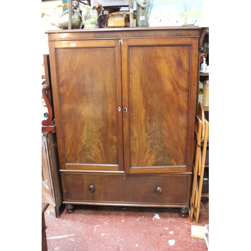 181 - An antique mahogany two door wardrobe with drawer, measuring 47