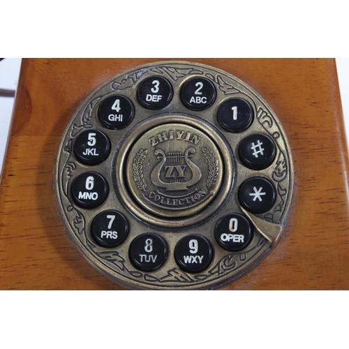 186 - A Steepletone wooden telephone.