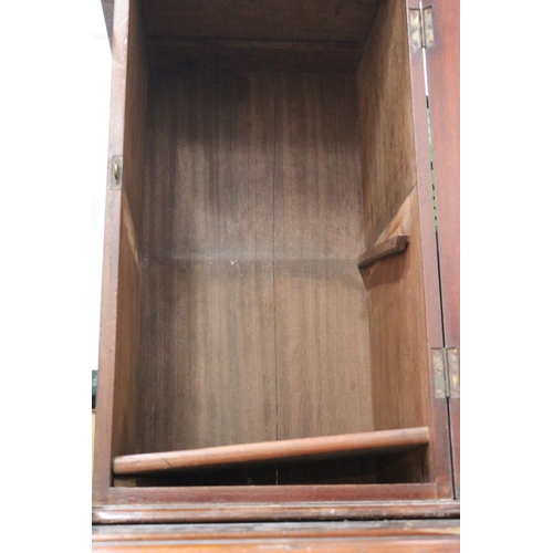 191 - An antique mahogany single door cabinet (a/f).