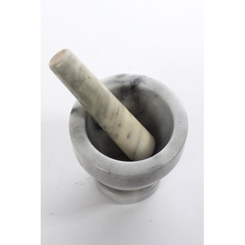 203 - A small marble pestle and mortar.