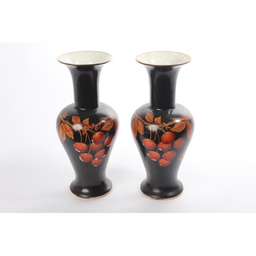 204 - A pair of hand painted vases.