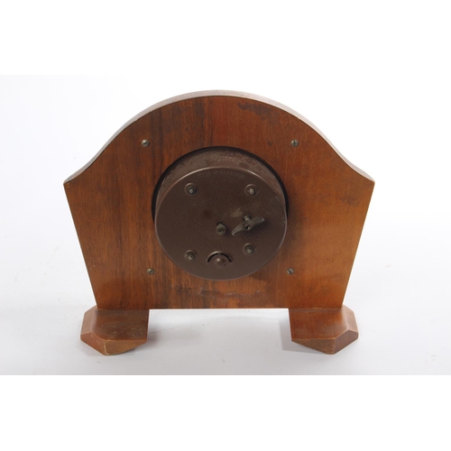 210 - A vintage wood cased mantle clock.