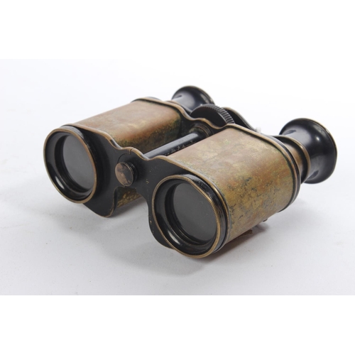 214 - A pair of antique binoculars/ field glasses.