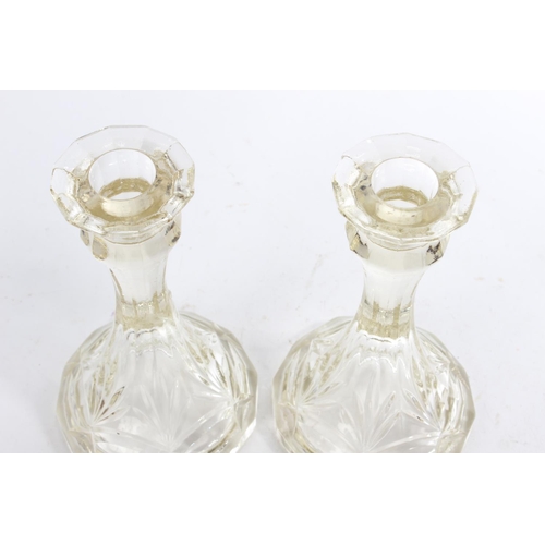 230 - Two vintage pressed glass candlesticks.