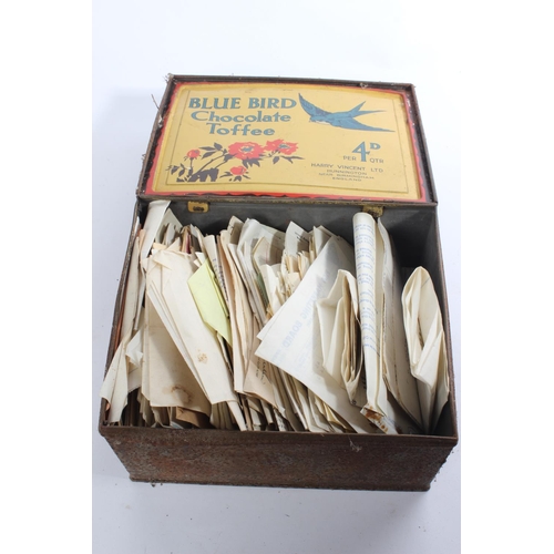 236 - A vintage Blue Bird sweet tin containing a lot of invoices and other paperwork dating back to the 19... 