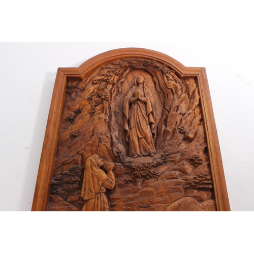 252 - A religious wood effect wall plaque.