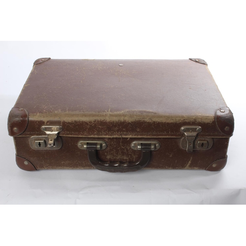 261 - A small vintage leather suitcase and a lot of assorted costume jewellery and more.