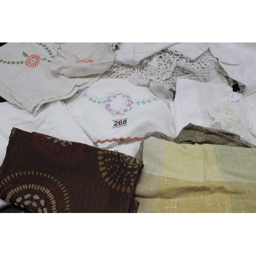 268 - A lot of vintage linen to include table cloths, place mats and more.