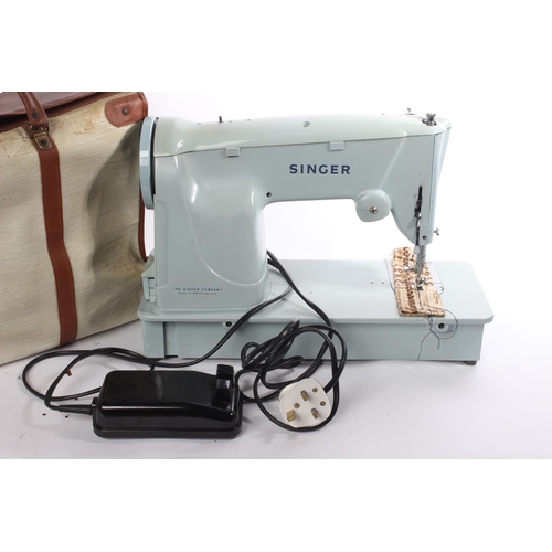 273 - A vintage cased Singer sewing machine.