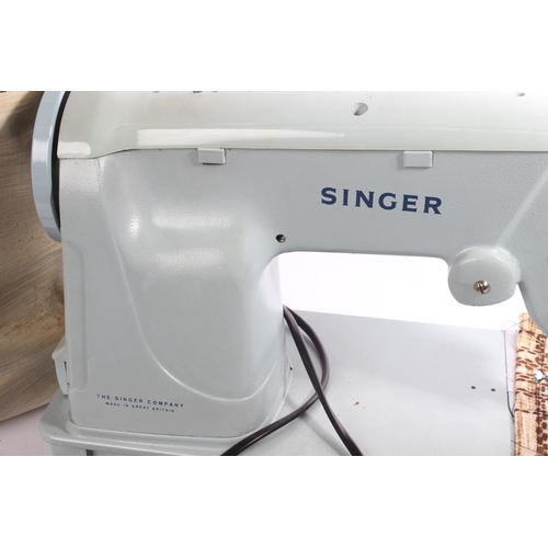 273 - A vintage cased Singer sewing machine.