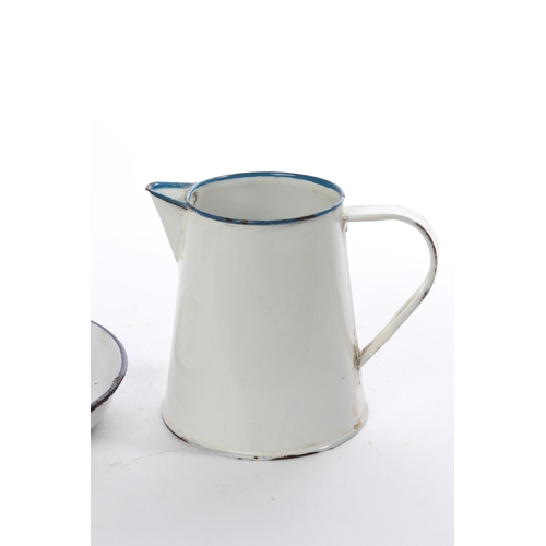 294 - A vintage enamel jug and candlestick.