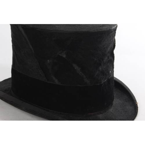 401 - A vintage top hat, stamped Cornmarket, Belfast.