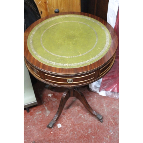 412 - A mahogany lamp table with leather top and drawer.