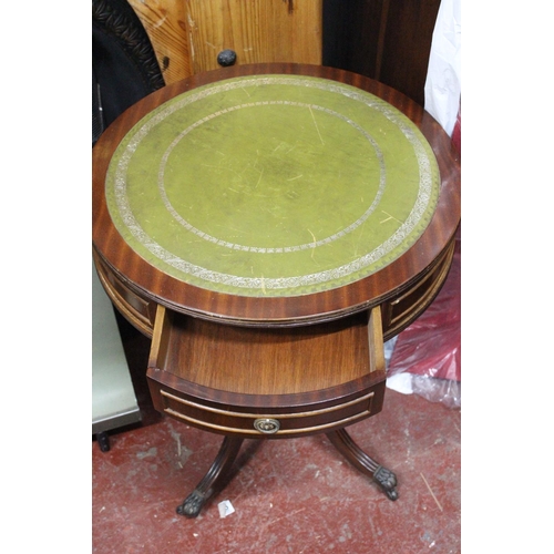 412 - A mahogany lamp table with leather top and drawer.