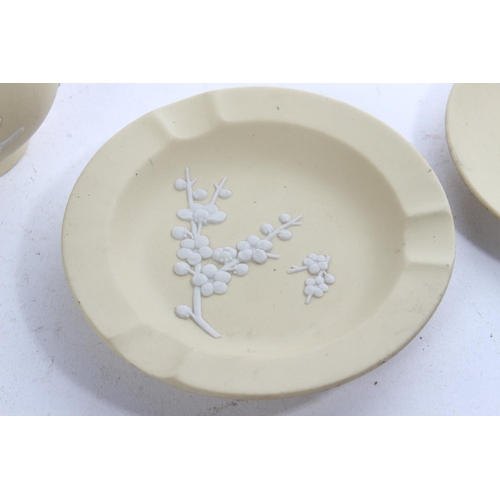 422 - Three pieces of Wedgwood white on primrose Jasper Ware.