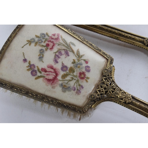 476 - A vintage three piece dressing table set.