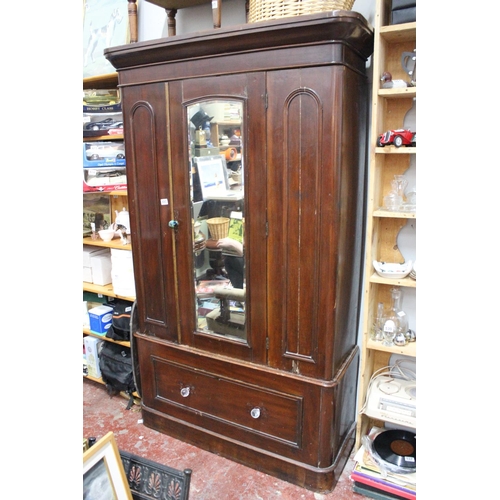 490 - An antique Irish pine mirror doored wardrobe (a/f).