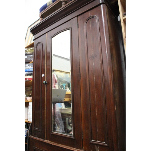 490 - An antique Irish pine mirror doored wardrobe (a/f).