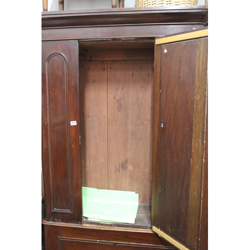 490 - An antique Irish pine mirror doored wardrobe (a/f).