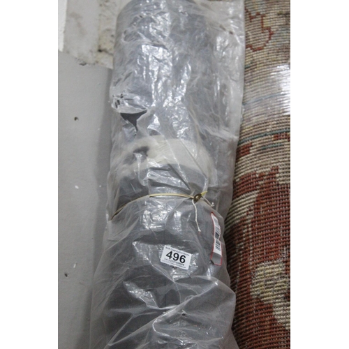 496 - A large roll of blackout curtain fabric.