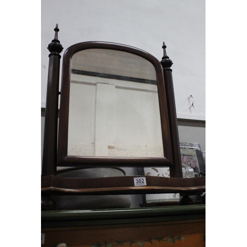 302 - An antique mahogany dressing table mirror.