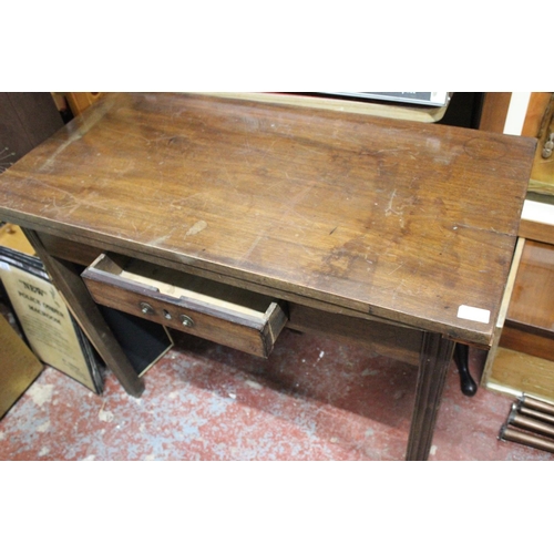 306 - An antique mahogany turnover leaf table.