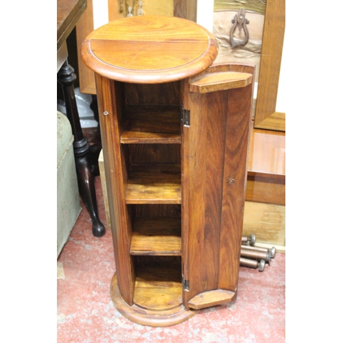 312 - A wooden pedestal style storage cabinet.