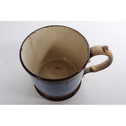 313 - A large antique cup, measuring 6