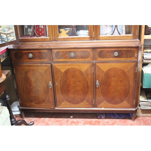 324 - A mahogany and inlay three door display cabinet.