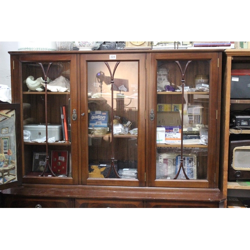 324 - A mahogany and inlay three door display cabinet.