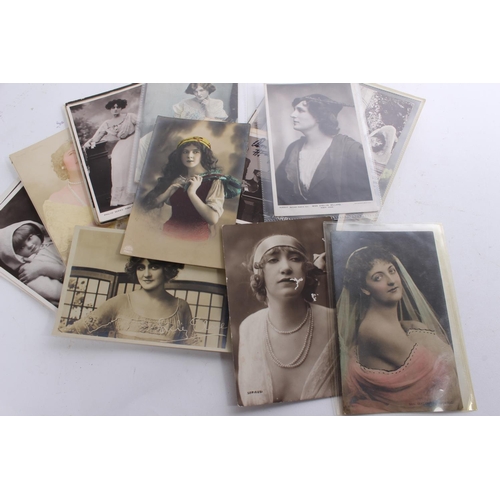 338 - A collection of antique portrait postcards and more.