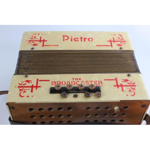 381 - A vintage cased Pietro 'The Broadcaster' accordion together with a 'First Step' How to play the Pian... 