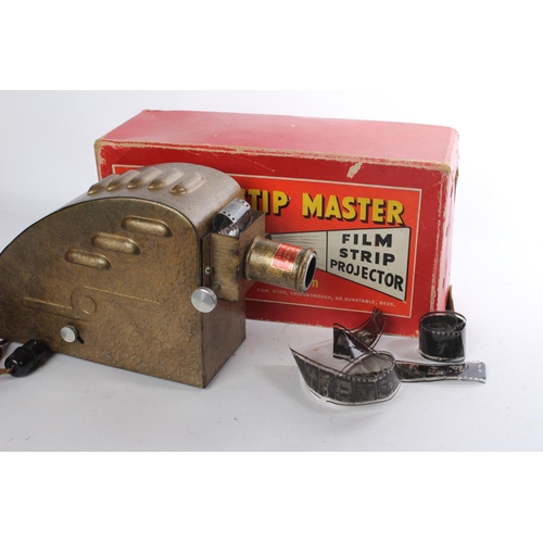 392 - A vintage boxed 'The Strip Master' 35m/m film strip projector and slides.