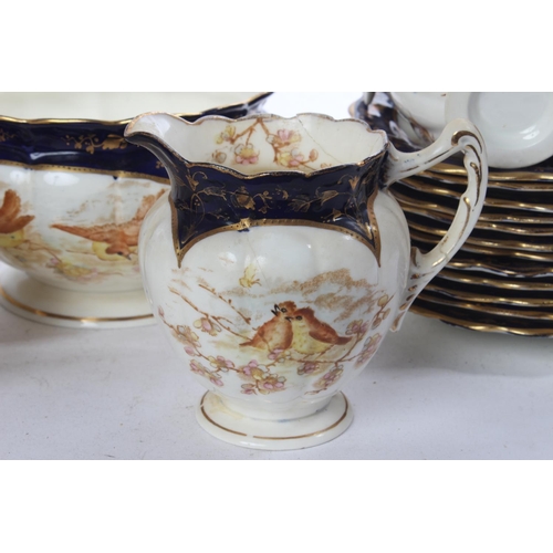 394 - A stunning antique bone china tea set decorated with birds (a/f).