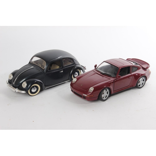 506 - An Anson Porsche 911 car and Volkswagen Beetle.