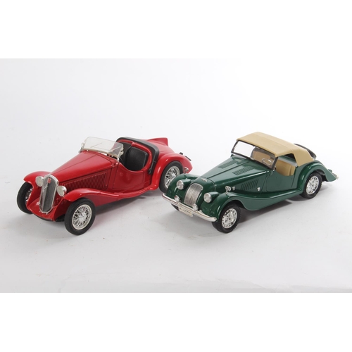 508 - Two antique style collectors cars.