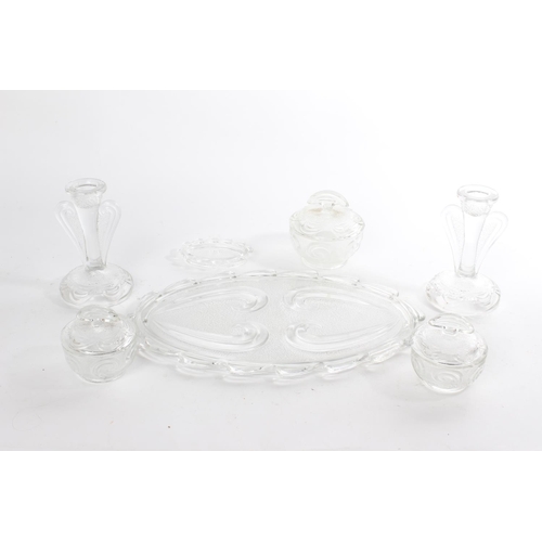 509 - A vintage pressed glass dressing table set.