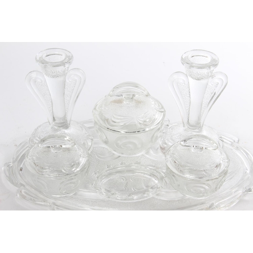 509 - A vintage pressed glass dressing table set.