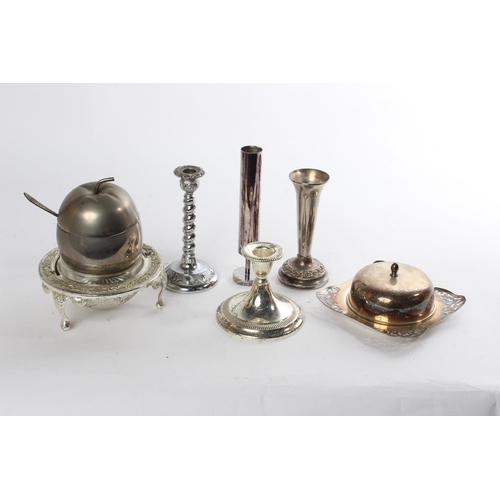 513 - A lot of silver plated and EPNS ware to include candlesticks, a butter dish and more.