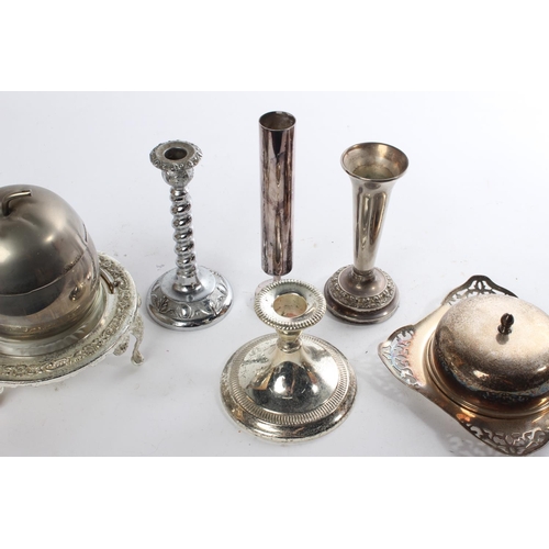 513 - A lot of silver plated and EPNS ware to include candlesticks, a butter dish and more.