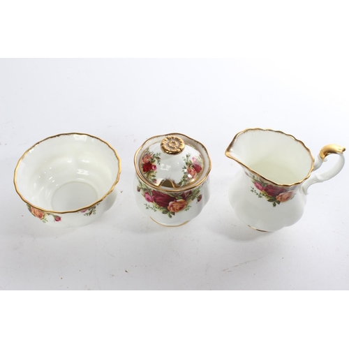 514 - A Royal Albert Old Country Rose milk jug, sugar bowl and preserve pot.