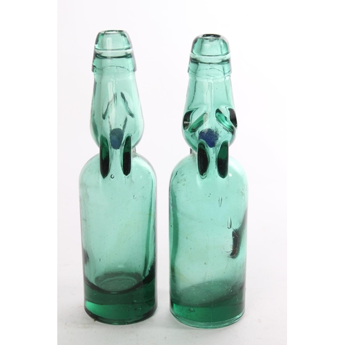 520 - Two vintage green glass bottles.