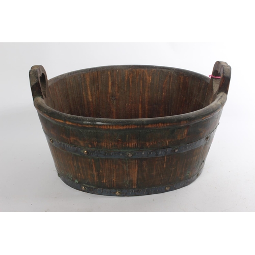 533 - A vintage wooden barrel planter.