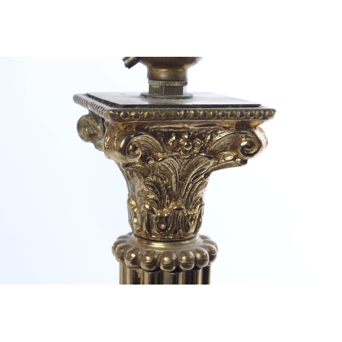 540 - An antique Corinthian brass table lamp base, measuring approximately 16