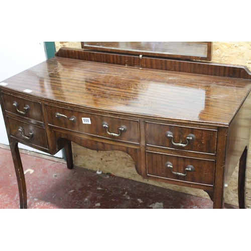 550 - A vintage mahogany dressing table and mirror.